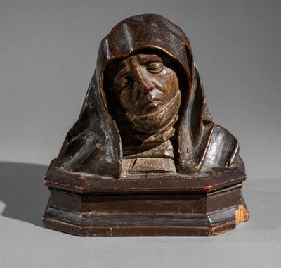 statue of a man with a hood on his head