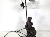 an image of a lamp that is on a table next to a lamp