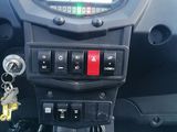 a car dashboard with a bunch of keys in it