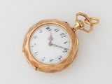 an image of a gold pocket watch on a white surface