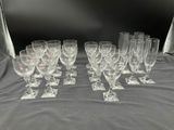 a lot of wine glasses sitting on a table