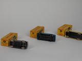 four different models of cars in a row on a white surface
