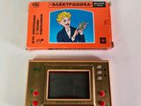 a small game console with a game on top of it