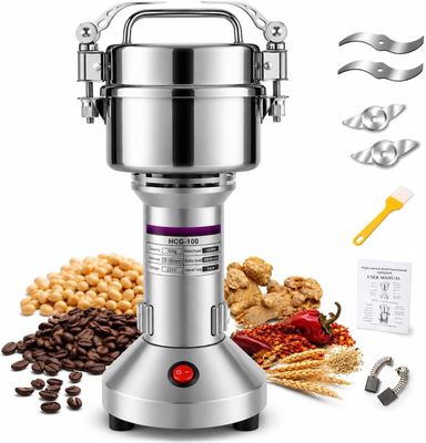 a close up of a blender on a white background with coffee beans