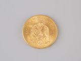 an image of a gold coin on a white surface