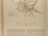 an open book with a map of a town on it