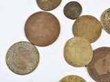 a lot of coins that are on a white surface