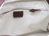 a close up of a purse with a zipper on it