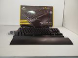 a black keyboard and a black mouse on a table