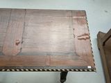 a small table with a wooden top and metal legs
