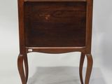 an image of a small wooden table with a drawer on it