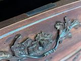 a close up of a wooden dresser with a drawer on it