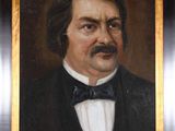 portrait of a man in a tuxedo in a black suit and bow tie