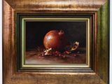 an oil painting of a pomegranate on a wooden table