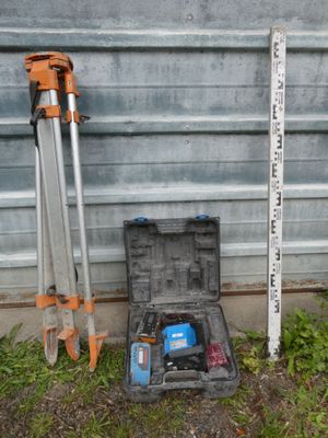 a tool box with tools in it next to a building
