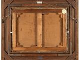 an old wooden picture frame with a picture hanging on the wall