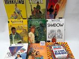 a lot of books that are sitting on a table