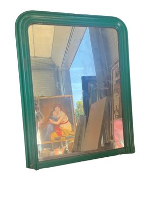 a mirror that has a picture of a child in it