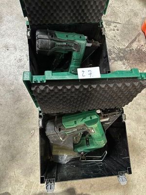 two tools in a case sitting on the floor