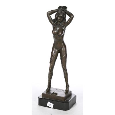 a bronze statue of a woman with a hat on her head