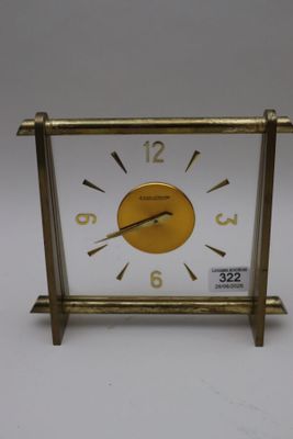 a small clock that is sitting on a table