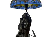 an image of a lamp with a dragonfly shade on it