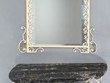 a mirror on the wall above a shelf with a mirror on it