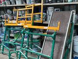 many cans of paint on the shelves in the garage