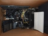a cardboard box with a bunch of electronics inside of it