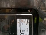 a close up of a metal object with a sticker on it