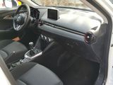 the interior of a car with the door open showing the steering wheel and dashboard