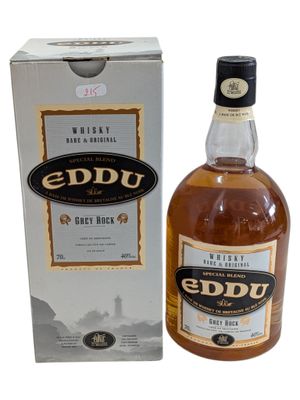a bottle of eddu irish whiskey next to a box