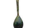 a glass vase that is sitting on a white surface