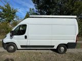a white van that is parked on the side of the road