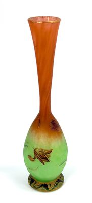 a glass vase with a bird design on it