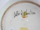 a plate with a picture of a woman on it