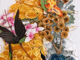 many different types of flowers in a vase on the table