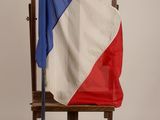 a chair with a flag on it and a flag on the back of the chair