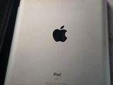 two ipads sitting on a table next to each other