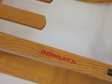 a wooden rocking horse that has a name on it