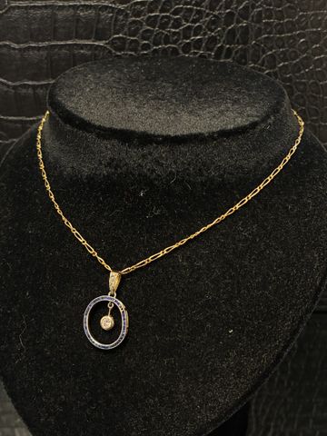 Chaine de cou et pendentif rond en or 18 carats 750 millièmes. En...