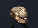 an image of a gold ring with the letter e on it