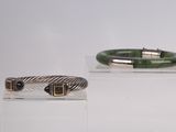 three different types of bracelets on display on a white surface