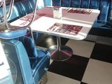 a black and white checkered floor in a diner