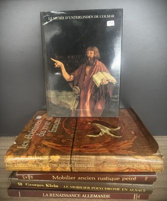 three books stacked on top of each other on a table