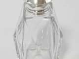 an image of a glass salt and pepper shaker on a white surface