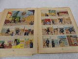 two pages of comics are open on a white surface
