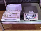 a table with a laptop and a cooler on top of it