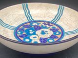 a blue and white bowl sitting on a table