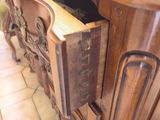 a wooden counter with a drawer on top of it